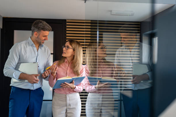 istock Company manager with his secretary going through business schedule 1465646760