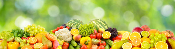 istock Delicious fresh vegetables, fruits, vegetables on blurred green 1465650636