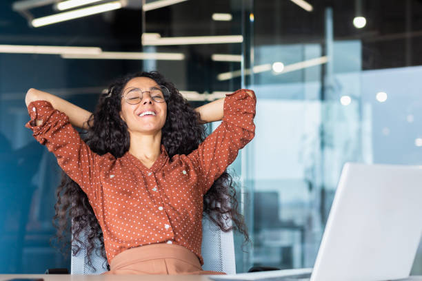 istock An Latin American student sits in the office, put her hands behind her head, rests, closed her eyes 1465651578