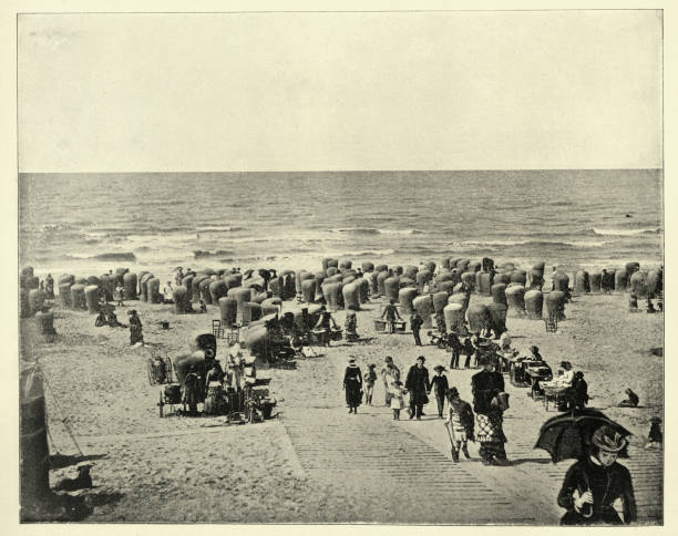 istock People on the beach of Scheveningen, Scheveninge, Victorian seaside resort, 19th Century, Vintage photograph 1465655231