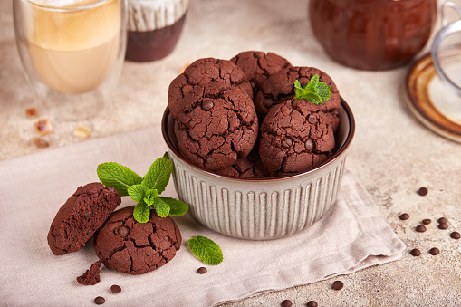 Chocolate brownie cookies with chocolate chips and cracks. Delicious homemade dessert.