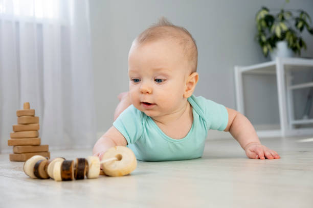 istock Cute little baby on floor 1465658651
