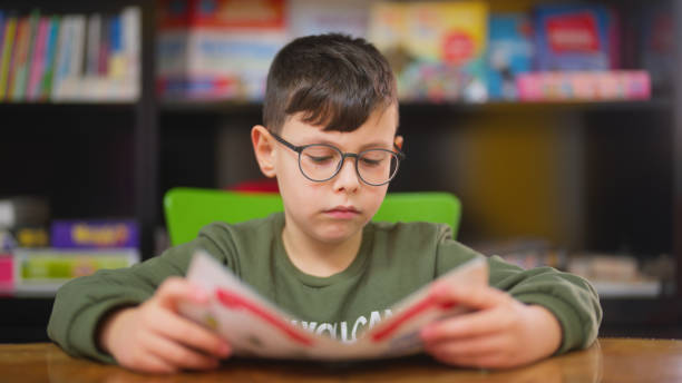 Boy Practicing Reading 2,300+ Childrens Book Shelf Stock Photos, Pictures & Royalty-Free ...