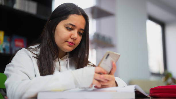 Library Study Phone 130+ Busy Public Library Stock Photos, Pictures & Royalty-Free Images ...