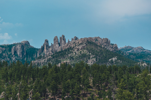 The granite peaks known as the Needle in the Black Hills in Custer State Park reach upward towards the summer sky.