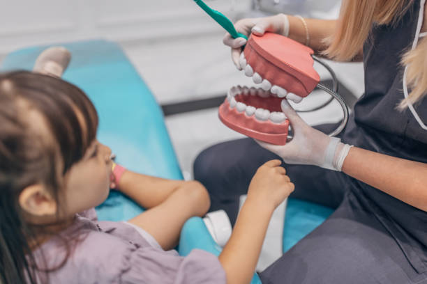 istock Little girl having fun at the dentist 1465669412