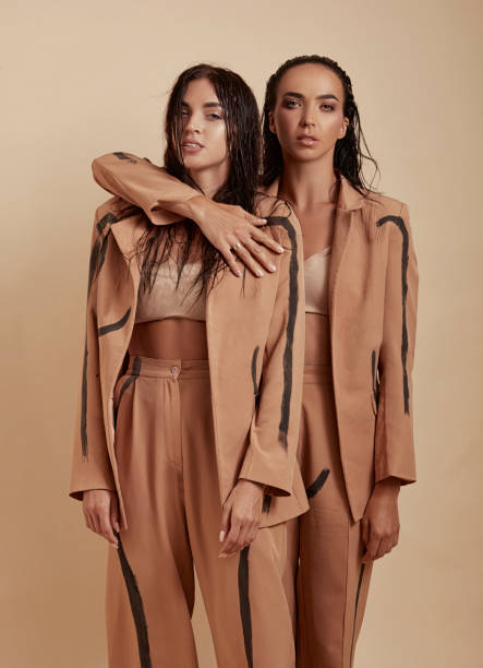 istock Two very close friends hugging each other, wearing the same outfit 1465670447