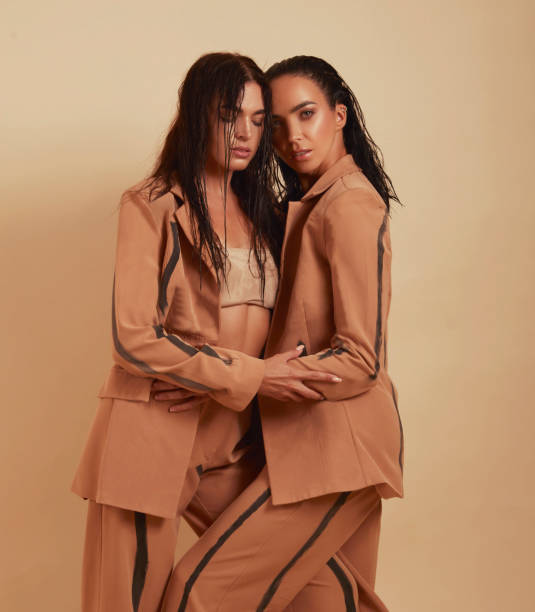 istock Two very close friends hugging each other, wearing the same outfit 1465670506