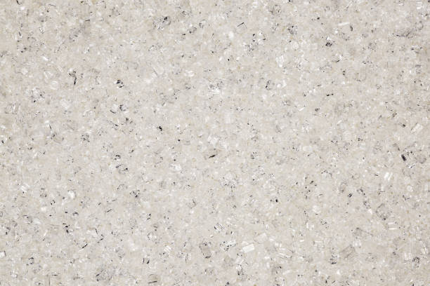 istock White sugar crumbly, crystals in bulk close-up, background wallpaper, uniform texture pattern 1465672787