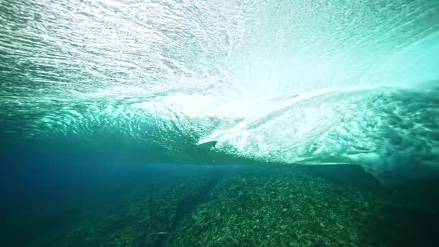 Underwater Tahiti 4k. Beautiful ocean wave, powerful wave breaking in slow motion. south pacific, Teahupoo. Adventure action water sports travel, surf destination in French Polynesia.