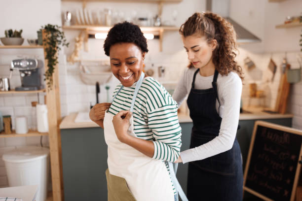 istock Two female chefs getting ready for work at their domestic kitchen 1465678536