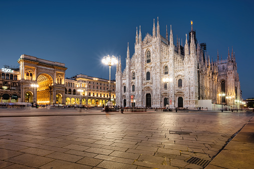 The landmark Milan Cathedral and the Galleria Vittorio Emanuele II Shopping Arcade on Piazza del Duomo in downtown Milan, Lombardy, Italy at night.