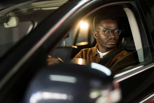 istock African American man driving his car. 1465683980