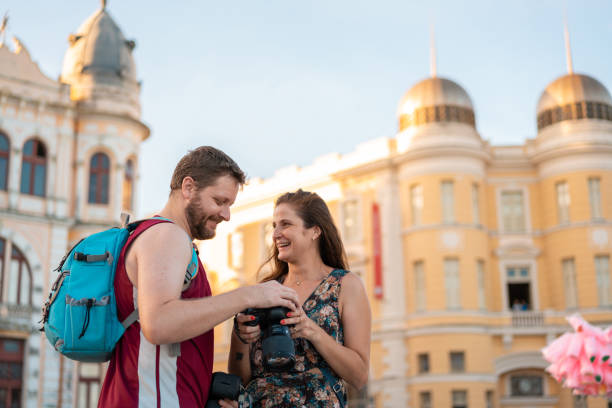 istock Photographer showing pictures on camera 1465685898