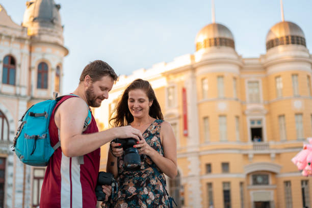 istock Photographer showing pictures on camera 1465685902