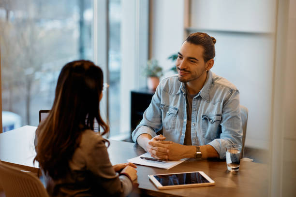 istock Happy Latin American man having job interview in the office. 1465697205