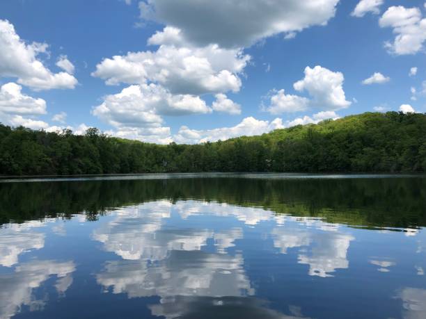 istock Clouds reflect on a calm lake in New Jersey 1465700745