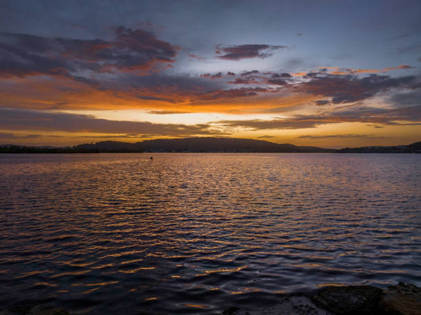 istock After the rain sunrise waterscape with clouds 1465704230