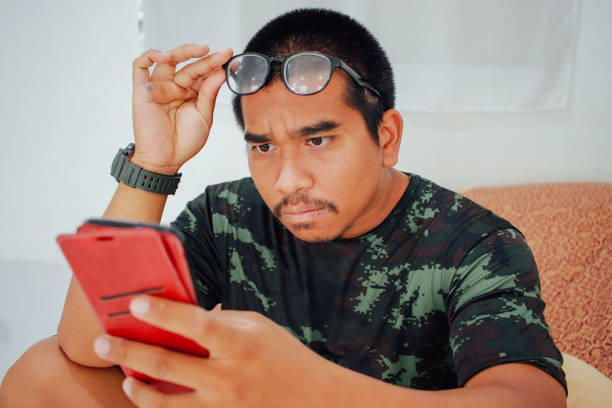 istock brown soldier watching phone 1465708880