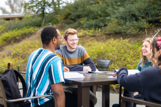 istock Friends studying at a table outdoors at college 1465708954
