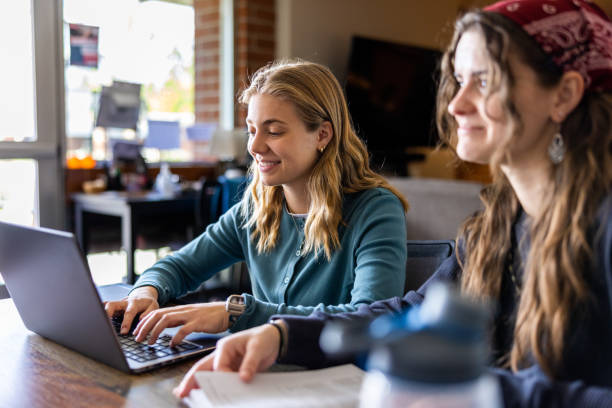istock Female college students working on a laptop at college 1465709086