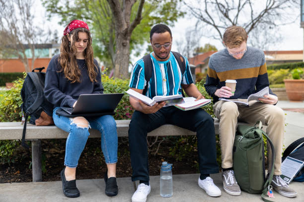 istock Friends studying on the bench at college 1465709162