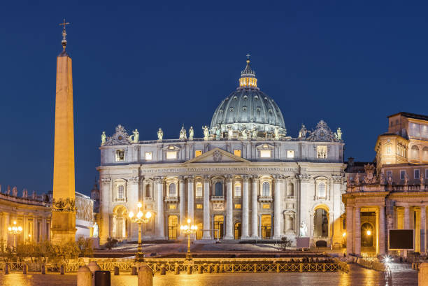 Low angle View of St. Peter's Basilica in Rome, Lazio, Italy on the Via della Conciiazione at night\