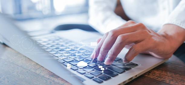istock close up businessman hand type on keyboard laptop to use about AI robotic chat programming to asking and get data information about innovation for A.I. development concept 1465725430