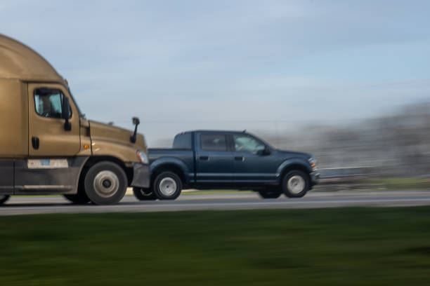 istock Truck and car moving on highway road 1465734133