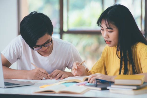 istock An asian students are reading books and study, Tutoring together. 1465736637