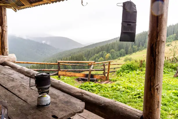 Photo of Mountain view from the hut. Table and gas system for cooking. Charging the solar panel on the go. Charge the solar battery.