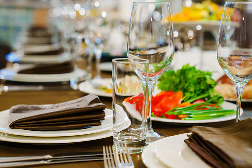 a festive served table with snacks and tableware. the concept of organizing banquets. catering and restaurant business.