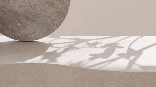 istock Blank beige curve concrete counter podium with texture, soft sunlight, leaf shadow on wall, gray flat round rock 1465749907