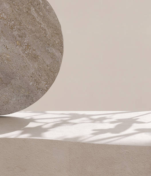 istock Blank beige curve concrete counter podium with texture, soft sunlight, leaf shadow on wall, gray flat round rock 1465749912