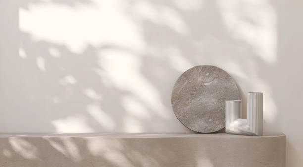 istock Blank beige brown cement curve counter podium with texture, dappled sunlight, leaf shadow on white wall, gray flat round rock and vase 1465749935