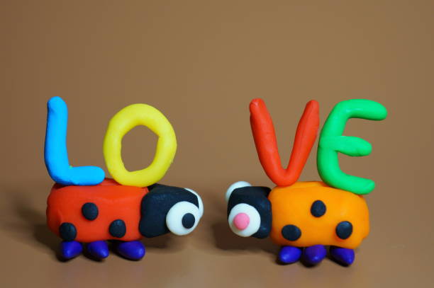 istock Two toy ladybugs look at each other. 1465753319