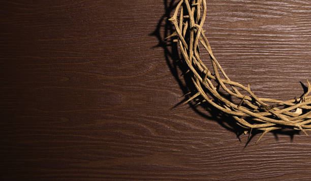 istock 3D rendering of crown of thorn placed on wooden table 1465755768