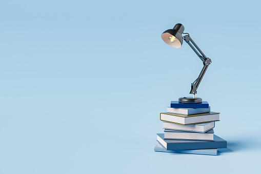 Lamp on stack of books
