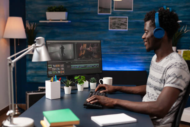istock Filmmaker editor sitting at desk table in creativity studio 1465757392