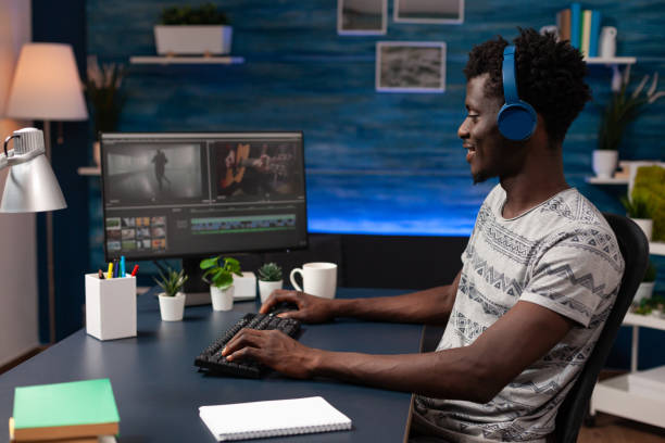 istock Filmmaker man editing movie footage on computer 1465757586