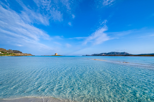Shallow turquoise water at La Pelosa, one of the most beautiful beaches in northern Sardinia