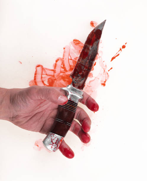 istock bloody knife in hand isolated on white background 1465759260
