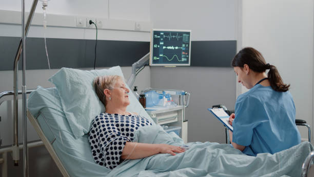 istock Medical assistant doing consultation with retired patient 1465760942
