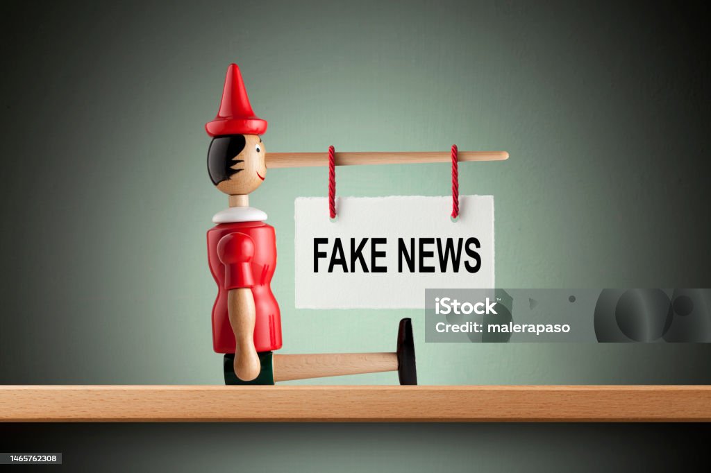 Fake News Pinocchio With Placard Hanging On The Nose Stock Photo ...
