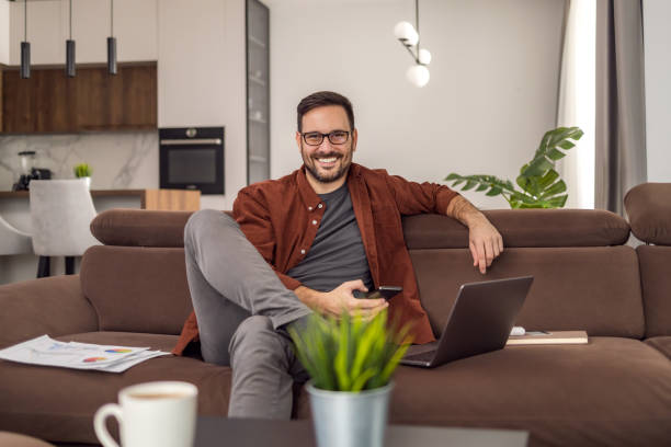 istock People,technology and business concept,man with laptop working at home office 1465764140