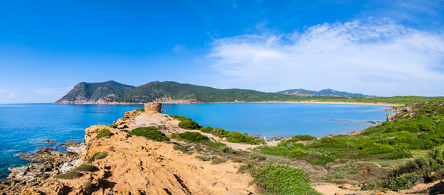 Deep bay of Porto Ferro with a solitary ancient tower in a remote angle in the northwest of Sardinia (5 shots stitched)