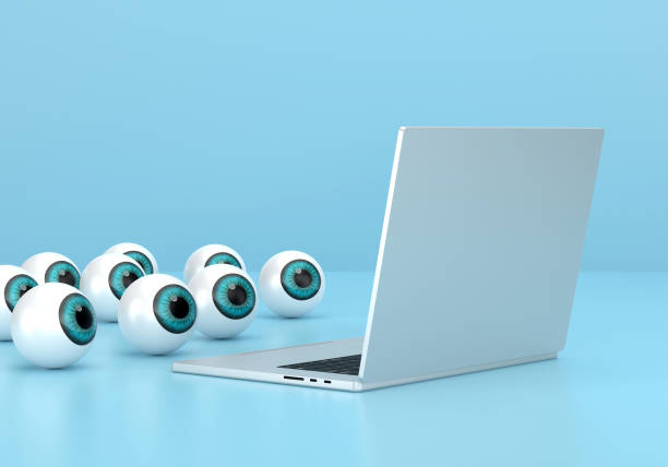 istock Abstract eyes looking at the laptop 1465764804
