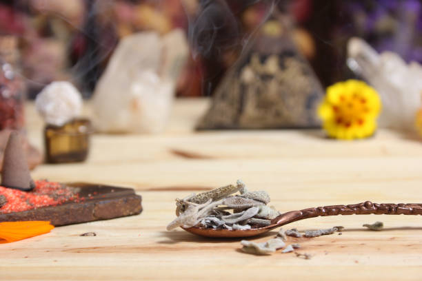 istock Sage in Vintage Spoon on Meditation Altar With Pyramid in Background 1465768036