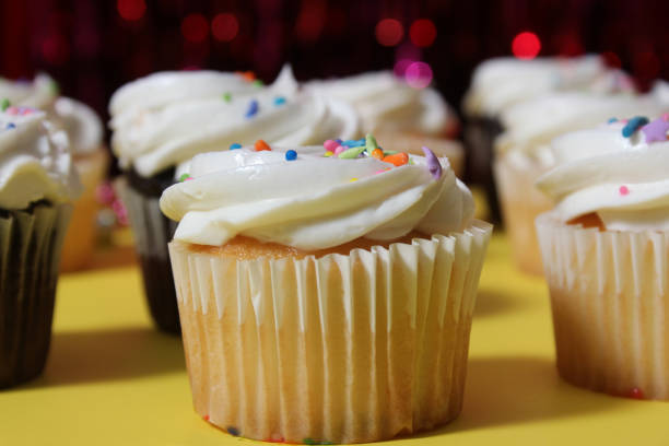 istock Cupcakes on Table at Party With Bokeh Background 1465768037