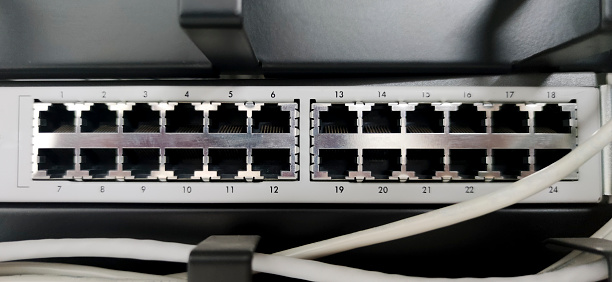 Ethernet Switch device full of wires. Closeup